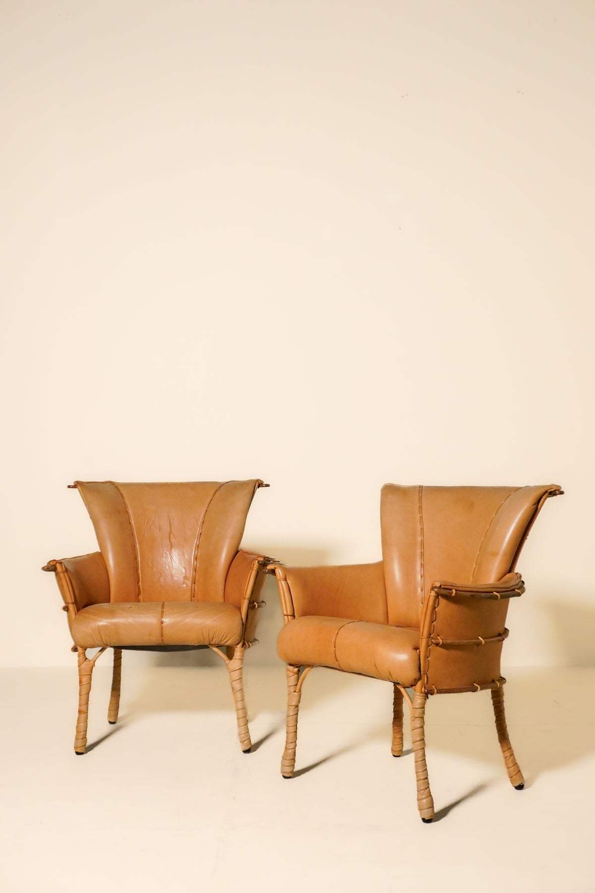 Pair of Vintage Pacific Green Navajo Tan Leather & Palmwood Arm Chairs