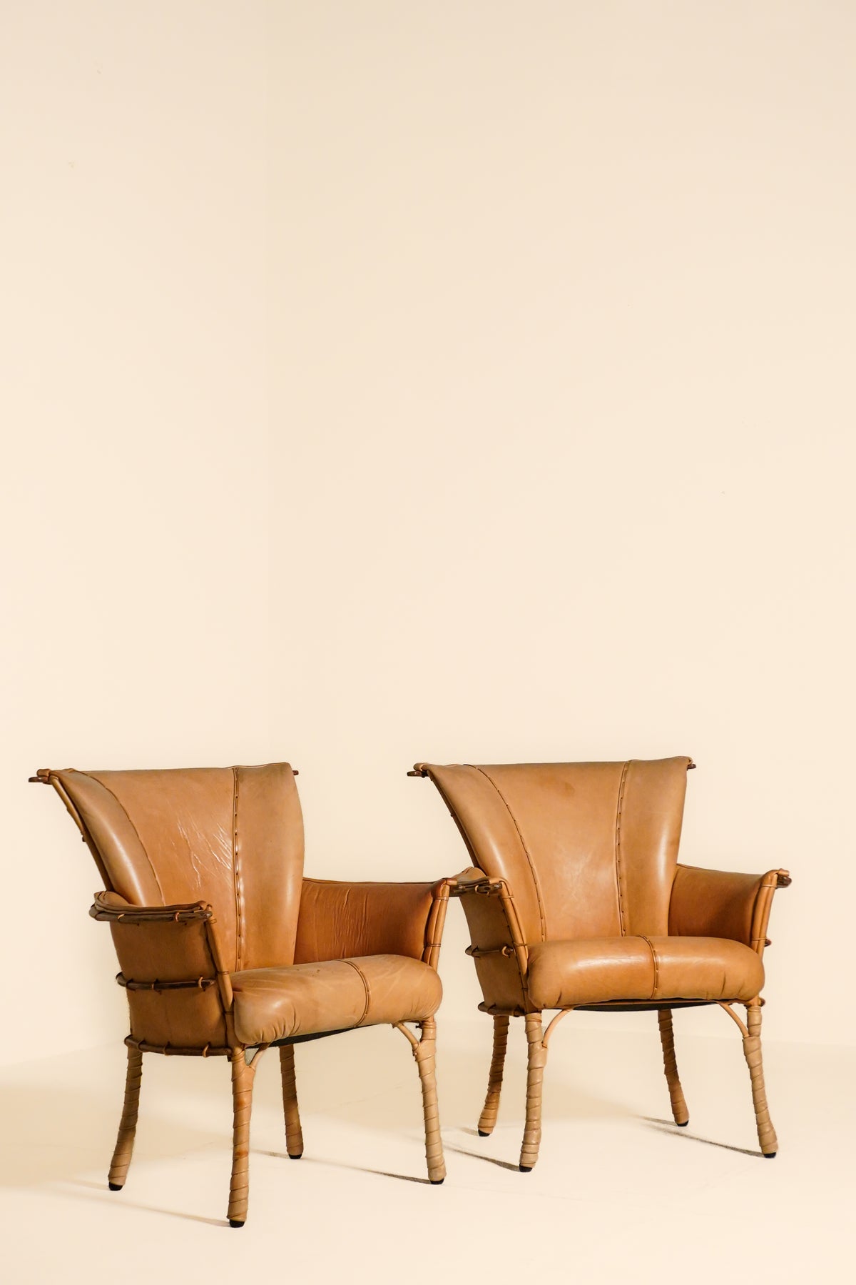 Pair of Vintage Pacific Green Navajo Tan Leather & Palmwood Arm Chairs