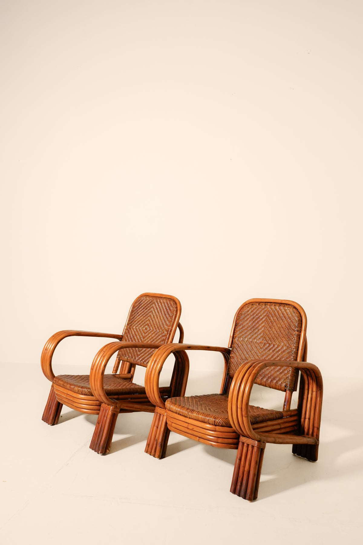 Pair of Bent Rattan Lounge Chairs — Mid-20th Century